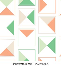 Fun modern triangle seamless vector pattern in orange, green and white.  Interesting pattern suitable for wallpaper, fabric or paper. 