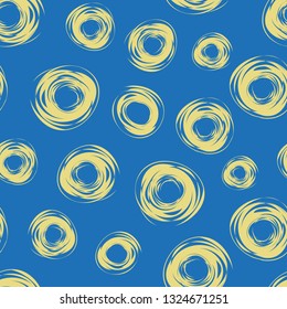 Funky yellow hand drawn abstract circles on vibrant blue background. Seamless vector pattern with a relaxed fun vibe. Great for wellbeing products, stationery, gift wrapping paper, fabric, home decor