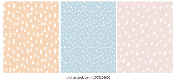 Funny Abstract Spots Seamless Vector Patterns. White Irregular Freehand Brush Lines on a Salmon, Light Blue and Pale Pink Background. Simple Infantile Style Geometric Print ideal for Fabric, Textile.