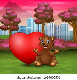 Funny baby bear sitting with red heart