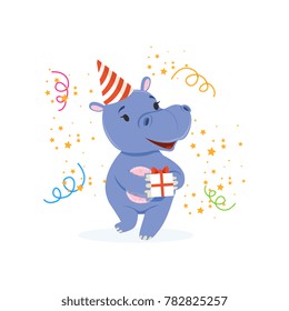 Funny baby hippo character in a party hat holding gift box, cute behemoth African animal vector Illustration