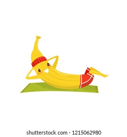 Funny banana working out on an exercise mat, sportive fruit cartoon character doing fitness exercise vector Illustration on a white background