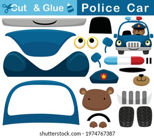 Funny bear on police car. Education paper game for children. Cutout and gluing. Vector cartoon illustration