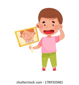 Funny Boy Holding Flashcard with Face Image Vector Illustration