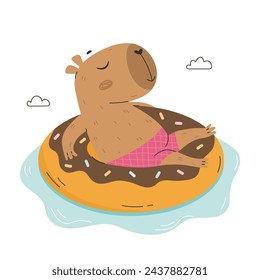 Funny capybara floating on inflatable ring