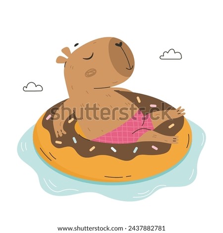 Funny capybara floating on inflatable ring