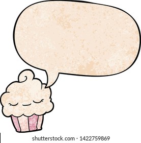 funny cartoon cupcake with speech bubble in retro texture style