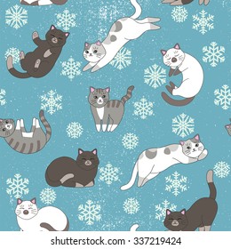 Funny cartoon cute gray white cats. Seamless pattern for children. Sleeping and playing kittens on the blue background. Winter texture. Snowflakes and snow illustration