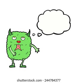 funny cartoon monster with thought bubble