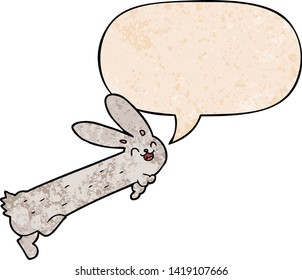 funny cartoon rabbit with speech bubble in retro texture style
