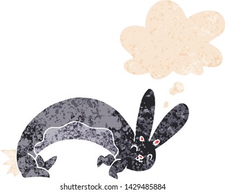 funny cartoon rabbit with thought bubble in grunge distressed retro textured style