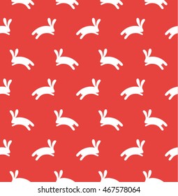 Funny cartoon seamless pattern with rabbits for children. Vector background.