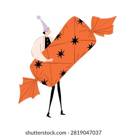 Funny character in festive hat carrying huge wrapped orange christmas candy. Cute hand drawn vector illustration isolated on white background