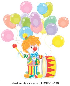 Funny circus clown beating his colorful drum, vector illustration in a cartoon style