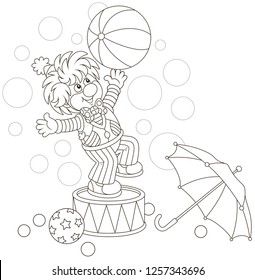 Funny circus clown playing a big ball and an umbrella, black and white vector illustration in a cartoon style for a coloring book