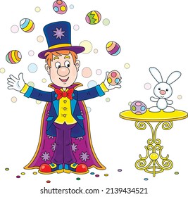 Funny circus magician illusionist with his mysterious hat and a magic cloak conjuring tricks with flying colorfully decorated Easter eggs, vector cartoon illustration isolated on a white background