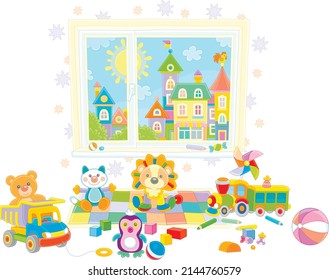 Funny colorful toys scattered after a merry game in a nursery room with a pretty small town outside a window, vector cartoon illustration isolated on a white background