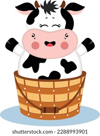 Funny  cow in a wooden bucket
