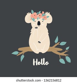 Funny cute koala in floral wreath sitting on a branch. Vector illustration. For greetings cards, decorations, prints, banners