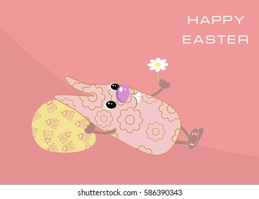 Funny Easter bunny lies and holds in his hand camomile. Happy Easter.