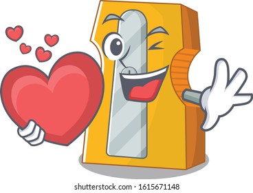 Funny Face pencil sharpener cartoon character holding a heart