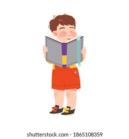 Funny Freckled Boy Standing with Open Book and Reading Vector Illustration