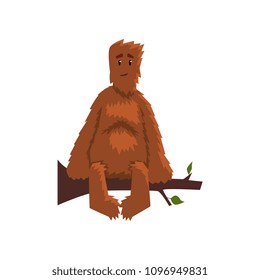 Funny friendly bigfoot sitting on tree branch, mythical creature cartoon character vector Illustration on a white background