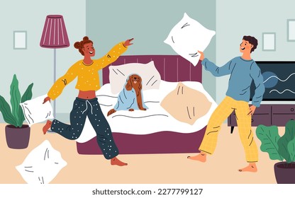 Funny friends at pajama party. Romantic pillow fight. Couple in love. People having fun in bedroom. Young man and woman in sleepwear relax together. Bedtime leisure