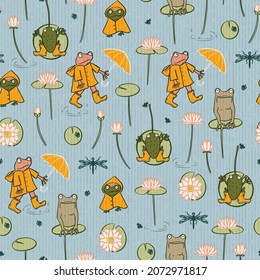 Funny frogs in rain clothes seamless pattern background print. Design in blue, yellow and green featuring dressed animals with rain boots, raincoat and umbrella. Amphibians with water lily. Vector