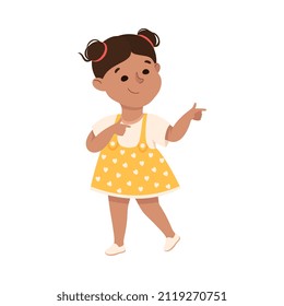 Funny Girl in Polka Dot Dress Pointing at Something with Extending Hand and Index Finger Vector Illustration