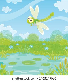 Funny green dragonfly flying over a meadow with flowers and a small pond on a pretty summer day, vector illustration in a cartoon style