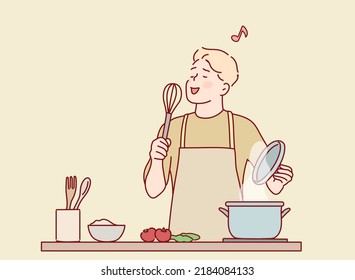 Funny guy singing song holding beater whisk microphone listening music in modern kitchen. Hand drawn style vector design illustrations.