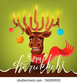 Funny Happy Hanukkah card. Cartoon, cute and happy Santa's (Christmas) reindeer (deer) with antler in form of menorah with candles, Christmas balls, red scarf. Happy Hanukkah calligraphy (lettering)