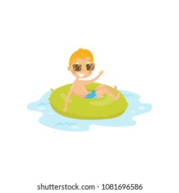 Funny kid swimming at sea on green inflatable ring. Little boy in swim shorts and sunglasses. Summer vacation. Flat vector design