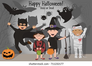 Funny kids in costumes celebrating Halloween on the background of ominous shadows. Halloween.