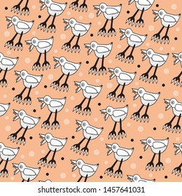 Funny kids seamless pattern orange   background for Halloween with scary birds with claws and teeth
