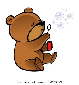 Funny little bear blowing bubbles in the air