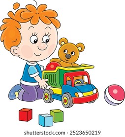 Funny little boy playing with a toy truck, a teddy bear and baby cubes, vector cartoon illustration on a white background