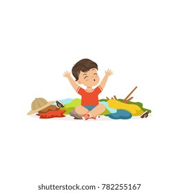 Funny little bully boy sitting among scattered clothes, hoodlum cheerful little kid, bad child behavior vector Illustration