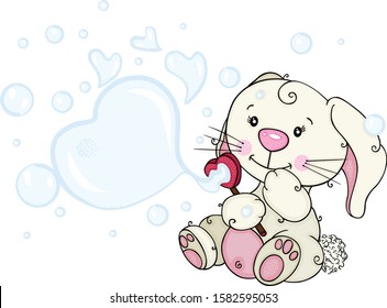 Funny little bunny blowing soap bubbles
