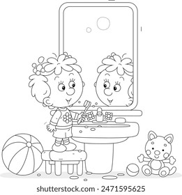 Funny little girl brushing her teeth at a mirror and washbasin in a bathroom with toys, black and white vector cartoon illustration for a coloring book