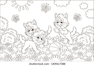 Funny little kittens playing with a ball and butterflies on grass among flowers on a sunny day, black and white vector illustration in a cartoon style for a coloring book