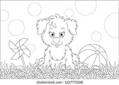 Funny little pup sitting on grass after a game with striped ball on a playground in a summer park, black and white vector cartoon illustration for a coloring book page