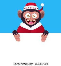 Funny monkey holding a blank banner. Cartoon monkey in a Christmas hat peeking from behind a blank banner.