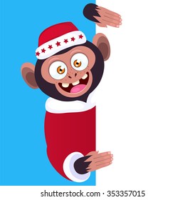 Funny monkey holding a blank banner. Cartoon monkey in a Christmas hat peeking from behind a blank banner.
