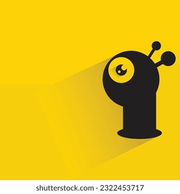 personaje monstruo gracioso con sombra sobre fondo amarillo