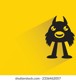 personaje monstruo gracioso con sombra sobre fondo amarillo