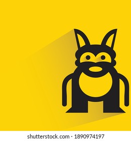 funny monster with shadow on yellow background