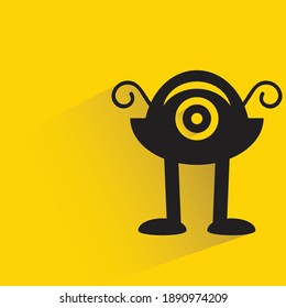 funny monster with shadow on yellow background