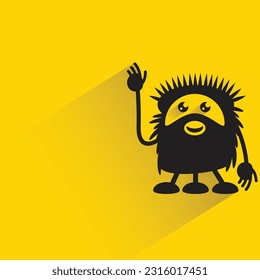monstruo gracioso con sombra sobre fondo amarillo